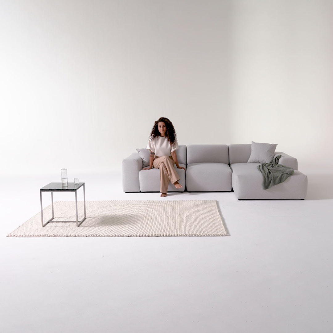 corner sofa grey PYLLOW with woman and marble side table