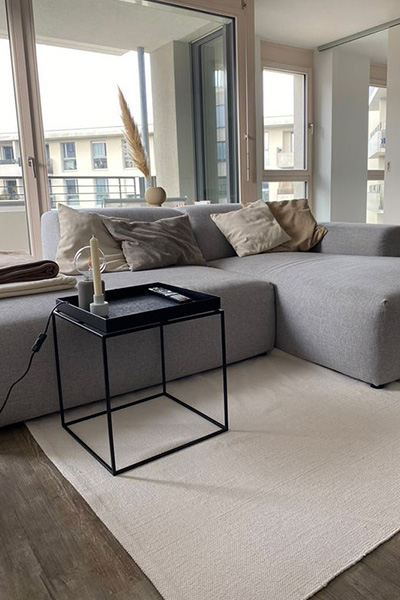 light grey PYLLOW sofa in minimalistic living room